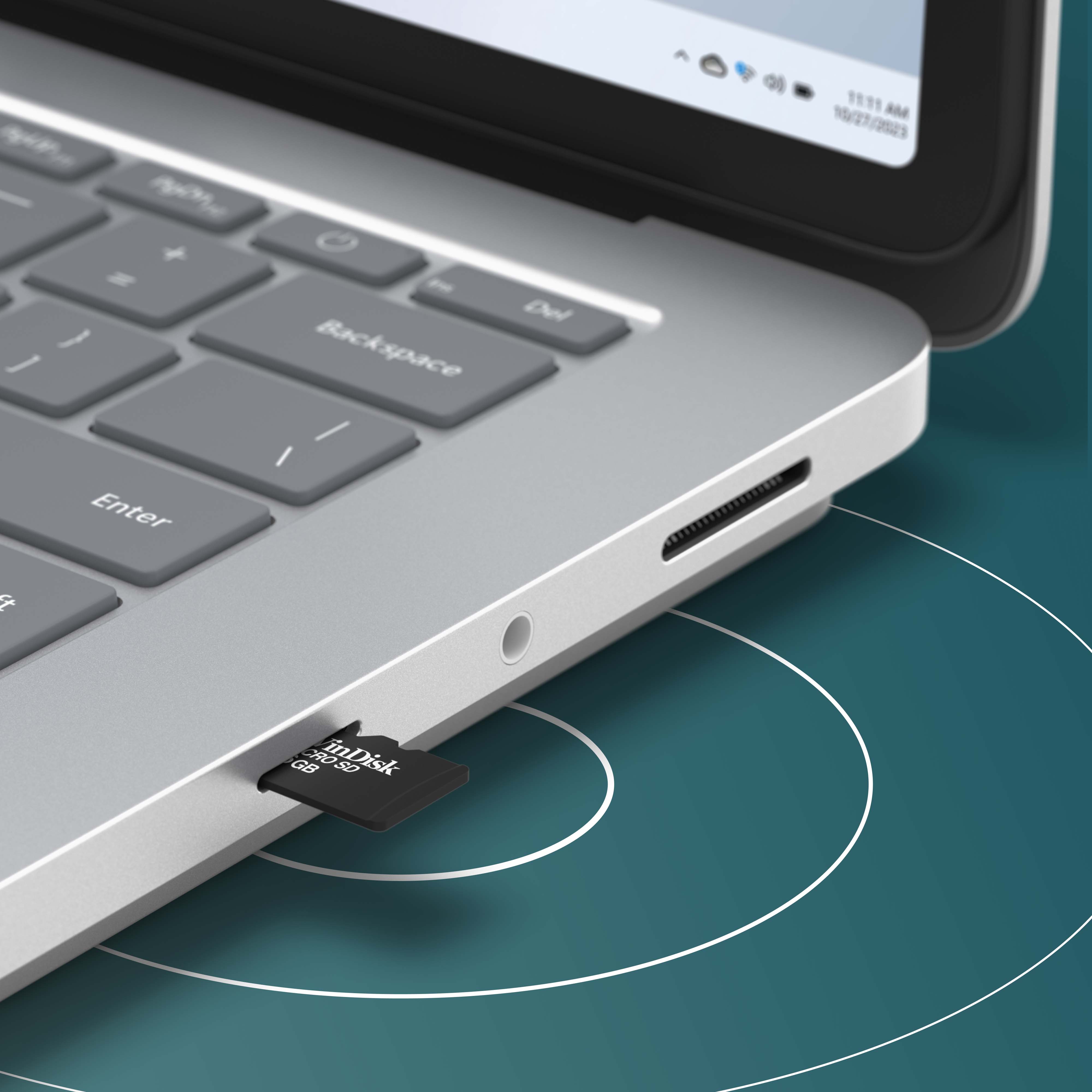 彩色背景中的 Surface Laptop Studio 2 的局部视图，画面上展示了此设备侧面的 microSD 读卡器。