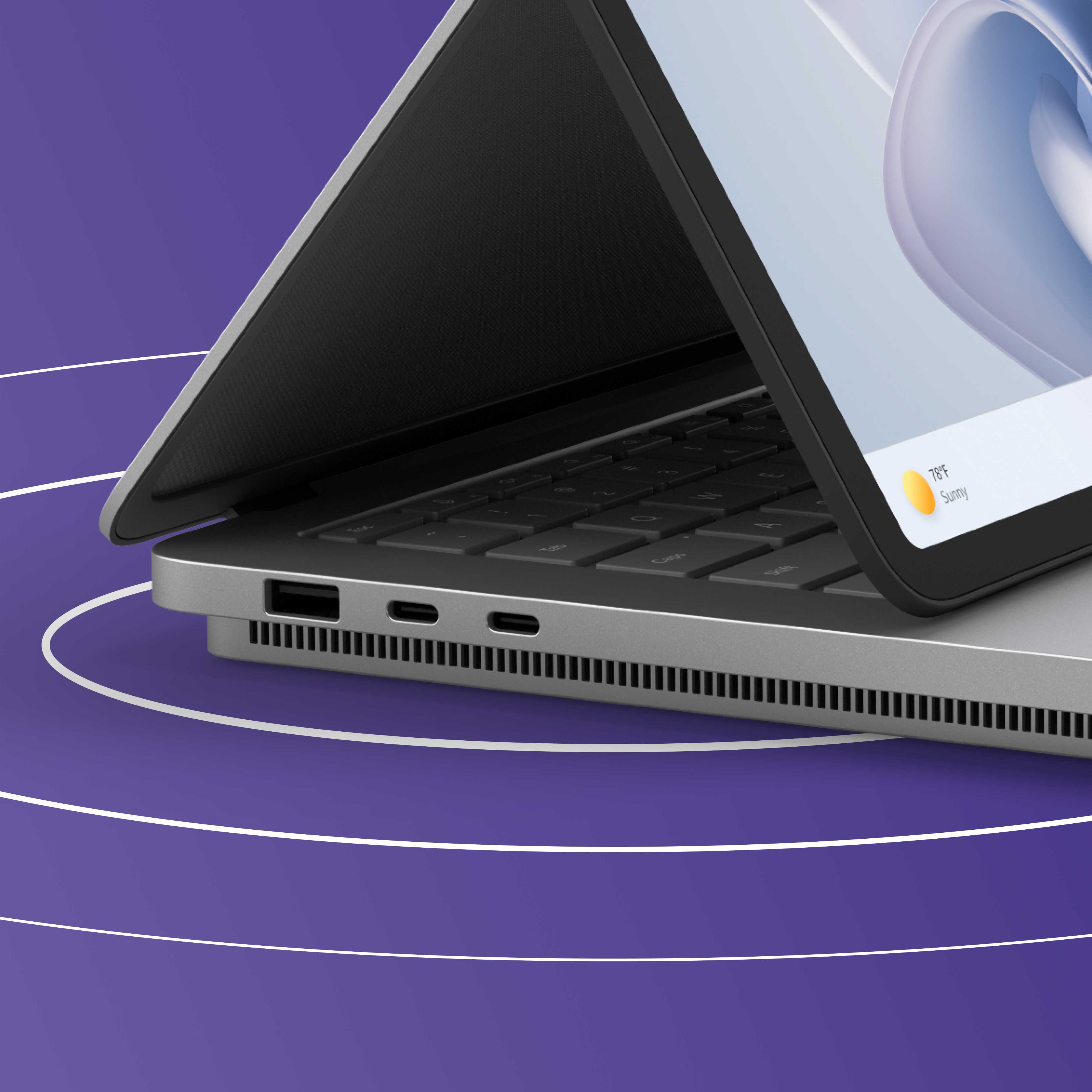 彩色背景中的 Surface Laptop Studio 2 的局部视图，画面上展示了此设备侧面的 USB 端口。